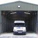 This is a huge roller door, Notice here how small the OZ-UK Steel Building Van looks against the backdrop of the St Johns Ambulance Steel Building SURREY