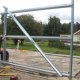 Built on the ground the first bay wall is carefully erected into place.